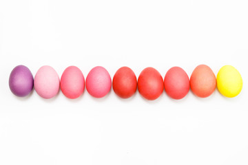 Easter multicolor eggs isolated on a white background. Rainbow. Copy space. Flat lay. Top view.