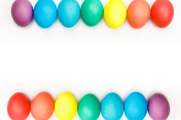 Easter multicolor eggs isolated on a white background. Rainbow. Copy space. Flat lay. Top view.