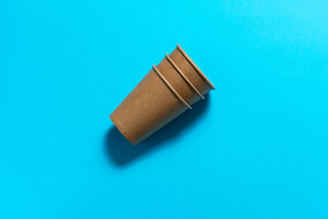 craft paper glasses on a blue background. eco friendly. isolate