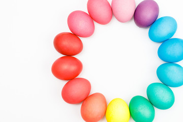 Easter multicolor eggs isolated on a white background. Rainbow. Copy space. Flat lay. Top view.