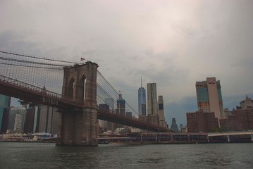 A cloudy day over the Brooklyn Bridge looking towards Manhattan in New York.
