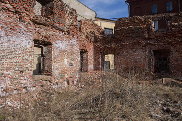 an old red brick building destroyed by time