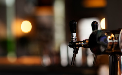 Close up detail beer cold tap in pub, selective focus