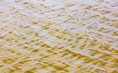 The surface of the water in the pond as an abstract background.