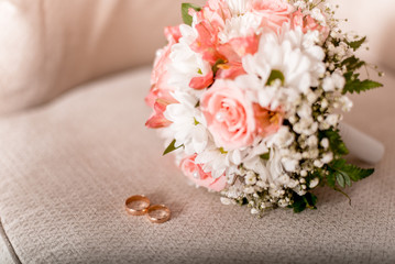Rings on the background of a wedding bouquet
