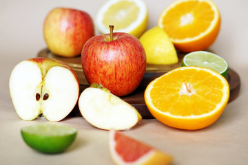 Naklejka na ściany i meble Beautiful fresh fruits lying on a light background