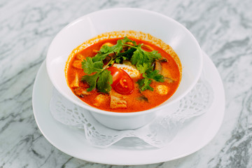 vietnamese spicy tom yam soup on a marble table