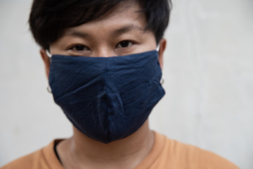 Blurred asian people using surgical mask protecting coronavirus.