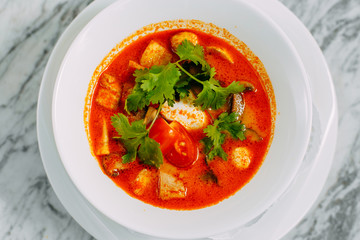 vietnamese spicy tom yam soup on a marble table