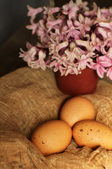 Eggs on the fabric. Eggs and flowers