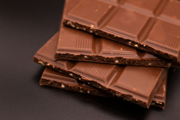 Chocolate slices on a dark background