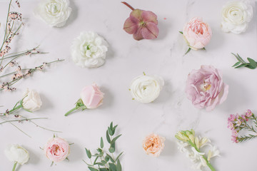 Fresh flower buds on marble background. Holiday gift concept.
