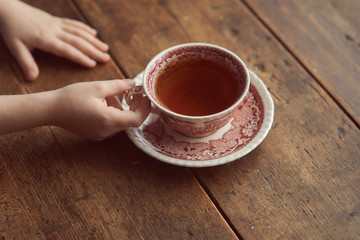 two cups of tea on a wooden table