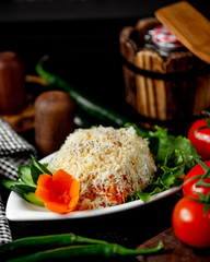 mimosa salad with cucumber and carrot flowers and tomatoes