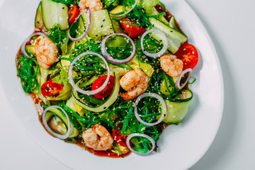fresh vegetable salad with shrimp, healthy eating isolated on white background