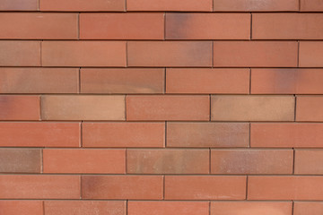 Background of new brick wall. brick wall of red color, wide panorama of masonry