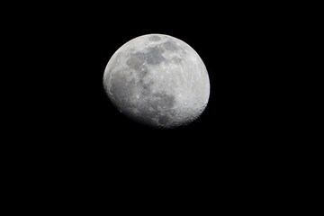 View of the moon and its craters over a dark night sky