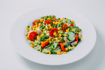 sweet corn, tomato and chicken salad, healthy food isolated on white background