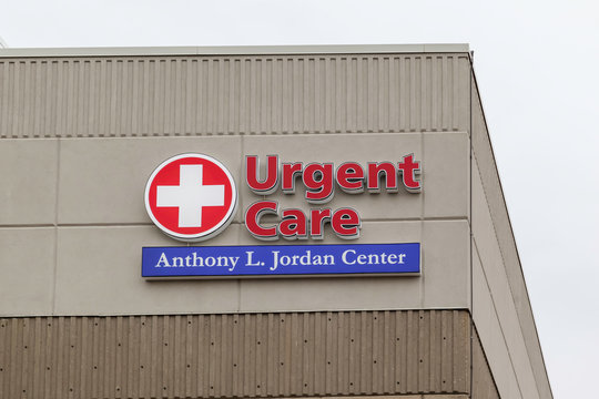 Rochester, NY, USA - March 3, 2020: Urgent Care And Red Cross Sign On The Building Of Anthony L. Jordan Health Center (AJHC) In Rochester, NY, USA. AJHC Is A Community Clinic. 