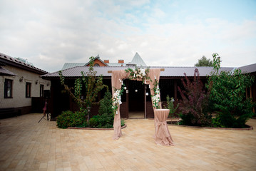 Wedding registration arch decorated with flowers
