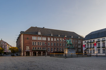 Empty atmosphere without people with historical landmark around old town square during quarantine from contagion of COVID-19 on Marktplatz  in Düsseldorf, Germany.