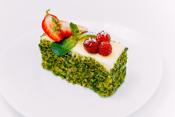 Dessert, fruit cake with mint berries isolated on white background