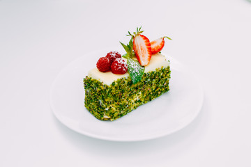 Dessert, fruit cake with mint berries isolated on white background