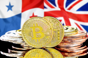 Bitcoins on Panama and United Kingdom flag background. Concept for investors in cryptocurrency and Blockchain technology in the Panama and UK.