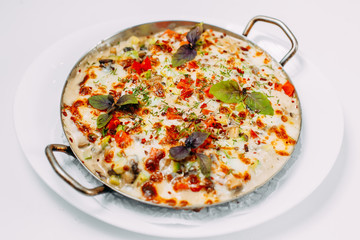 cheese casserole with vegetables, on a white background