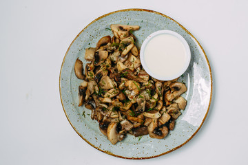garnish for a dish of fried champignon mushrooms, on a white background