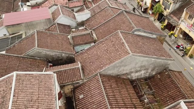 a flying camera is filming Halong Bay. Boats float along the river