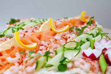 Smörgåstårta, Swedish sandwich like cake or sandwich torte is a dish with fish ingredients like salmon, shrimps and prawns. Popular in Iceland as well as Finland.