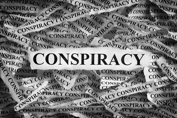 Strips of newspaper with the word Conspiracy typed on them