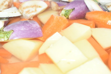 Closeup view of cutting vegetable.