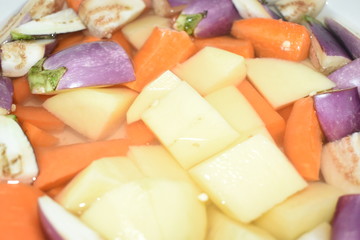 Closeup view of cutting vegetable.