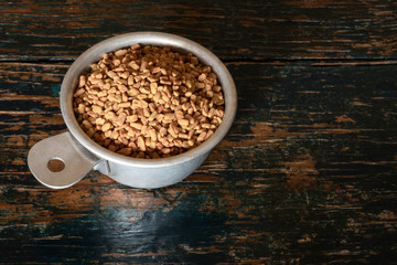 Fenugreek in a Measuring Cup