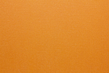 orange background of textured linen paper. detail paper structure.