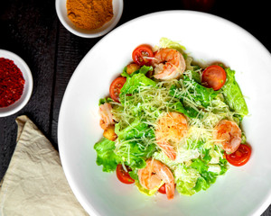 shrimp caesar salad with lettuce parmesan cherry tomato and bread stuffing