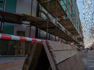 Scaffolding and fencing near the restored building in Stoleshnikov lane in Moscow