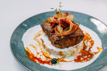 fried liver with onions and rice garnished