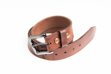 A formal studio product shot of a men’s used brown leather belt with patina set on plain white background.