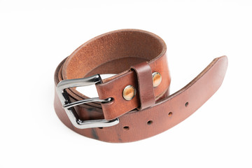 A formal studio product shot of a men’s used brown leather belt with patina set on plain white background.
