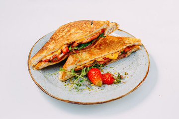 triangular meat and tomato sandwiches