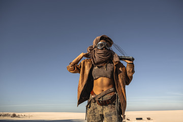 Post-apocalyptic Warrior Woman Outdoors in a Wasteland - obrazy, fototapety, plakaty
