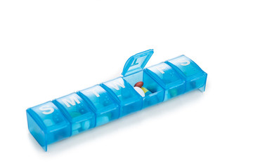 Pill organizer box storing doses of daily medicine