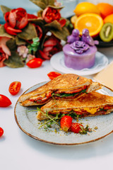 triangular meat and tomato sandwiches