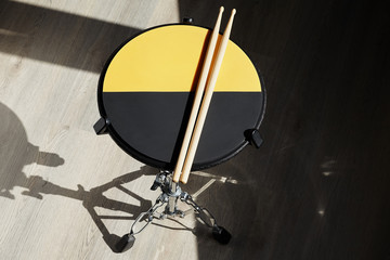 Drum practice pad and drumsticks. Drummer.