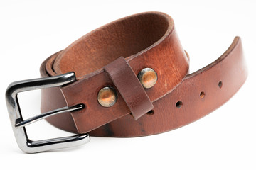 A formal studio product shot of a men&rsquo;s used brown leather belt with patina set on plain white background.