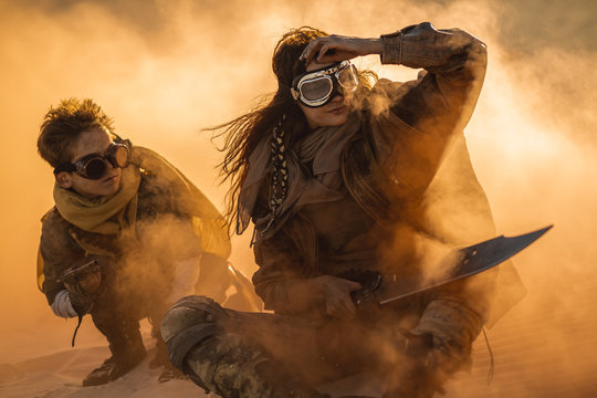 Post Apocalyptic Woman And Boy Outdoors In A Wasteland