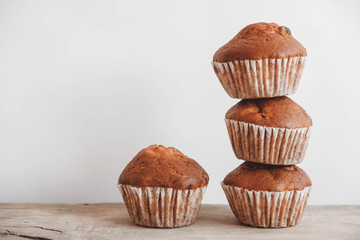 Chocolate cupcakes on wooden table background. Copy, empty space for text